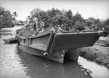 One of the Japanese barges after the battle. The fluted bottom allows the barge to retract from the beach easily.