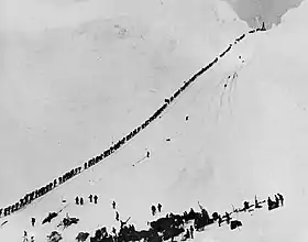 Image 4Miners and prospectors climb the Chilkoot Trail during the Klondike Gold Rush. (from History of Alaska)