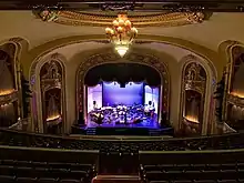 Picture of the stage of the Missouri Theatre set up for a performance of Alarm Will Sound