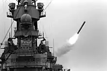 Battleship USS Missouri launching a Tomahawk missile