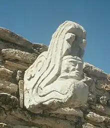 Image 37Ballcourt marker from the Postclassic site of Mixco Viejo in Guatemala. This sculpture depicts Kukulkan, jaws agape, with the head of a human warrior emerging from his maw. (from Snake)