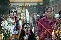 Girls with sugar skull make-up photographed in Mexico City, celebrating Day of the Dead, 2014.