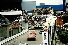 Photo of car racing along promenade