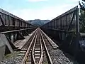 The windbreaks extend well above the plate girders.