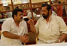 Mohanlal talking to actor Madhu