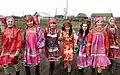 Scarved Moksha girls in traditional costumes.