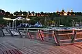 The pier in Płock, Poland. The view on the Tumskie Hill and the amphitheatre by night from the pier, with Płock Cathedral and the castle.