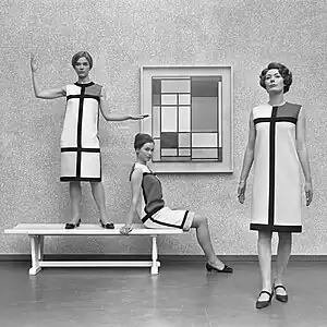 Mondrian dresses by Yves Saint Laurent shown with a Mondrian painting in 1966