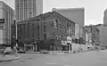 00 Block of Monroe from Farmer Street with 74-78 Monroe in the foreground, 1989.