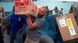 Montgomery offloads earthquake relief supplies in Jacmel, Haiti. January 16, 2010