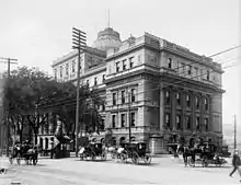 Exterior of four story building constructed in granite