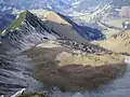 View from the summit to the plateau below with a small nameless lake