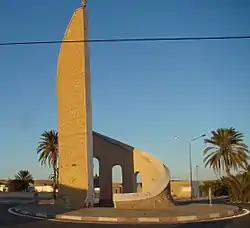 Monument at eastern entry to Souk Lahad  with anti-Ben Ali graffiti