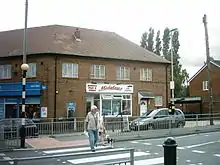 Shops on Butcher Hill/Spen Lane.  Midgleys was used in Yorkshire Television drama Fat Friends