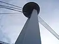 Close-up of the bridge's pylon and the "flying saucer" from below