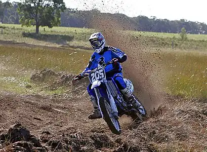 Image 18MotocrossCredit: Fir0002Motocross is form of motorcycle or ATV racing held on enclosed off-road circuits. The tracks are often quite large, natural, terrains with very few man made jumps, unlike Supercross, a sport that was originally derived from Motocross and is executed on a smaller track with many more extreme man made obstacles.More selected pictures