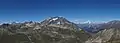 Mountain peak near the snow line and several mountain peaks above the snow line.