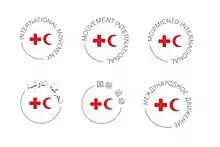 Circles with red crosses and crescents inscribed and the words "international movement" written in English,  French, Spanish, Arabic, Chinese, and Russian