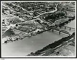 Image 9An aerial view of Murray Bridge in 1953 showing rail and road bridges, and also paddle steamers. (from Transport in South Australia)