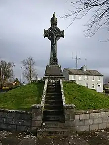 A photograph of the cross on the mound in Murroe