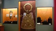 Old regalia of the image including its breastplate, halos, crowns, scepters, baton, and vestments at the museum.