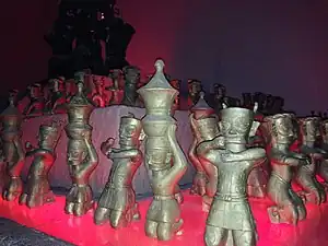 Bronze figurines wearing belted tunics, Sanxingdui