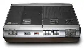 A Philips N1500 video cassette recorder, with wooden cabinet.