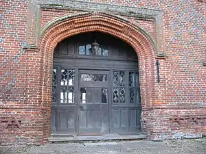 Depressed Tudor arch on Layer Marney Tower in Essex, England