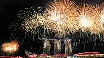 Image 35Fireworks over the Marina Bay skyline following the conclusion of the 2015 National Day Parade on 9 August 2015. (from History of Singapore)