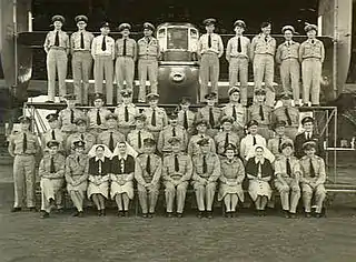 Three rows of uniformed men and women in group portrait