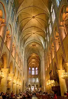 Nave looking to the east: six-part rib vaults, clerestories remodeled after 1220, three levels only.