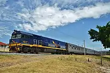 NR27 with an eastbound Indian Pacific in suburban Perth, 2013.