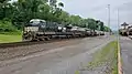 GE AC44C6M #4046 leads a manifest on track 2, with the Central of Georgia Railway heritage unit, GE ES44AC #8101, trailing