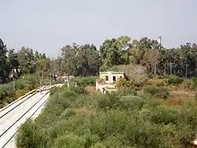 Remains of the Wadi al-Sarar Railway Station, on the Jaffa–Jerusalem railway line, located 3 km (2 mi) due north of the village.