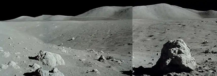 Nansen crater at the base of South Massif, facing north.  Note the rover near the right edge for scale.  The boulder in right foreground (boulder 2) was heavily sampled by the astronauts.