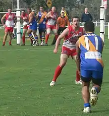 George Quadina kicks for goal against Canada in 2008.