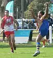 Nauruan player kicks a goal from long range against Canada during the 2008 Australian Football International Cup