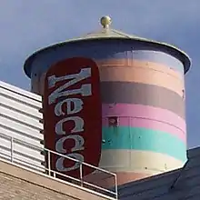 The water tower of the Necco facility on Massachusetts Avenue in Cambridge, Massachusetts, painted in 1996 to resemble a roll of Necco Wafers.