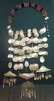 A necklace made of brass, mother-of-pearl and beads