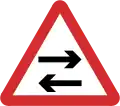 B22: Two-way traffic crosses one way road