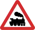 B40: Railway level crossing ahead without gate or barrier