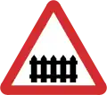 B41: Railway level crossing ahead with gate or barrier