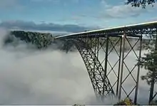 Bridge as seen from the National Park Service Visitors Center, with fog in the New River Gorge below