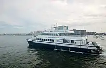 A large white boat sailing into the distance