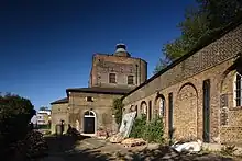 Photograph of exterior of industrial brick buildings