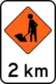 (TW-1B.1.2) Road workers ahead in 2 kilometres