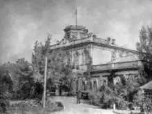 Photograph of a large ornate estate house