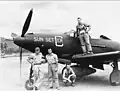 In New Guinea with P-400 Airacobra-Ia of 7th Fighter Command (Rasmussen on wing; others unidentified)