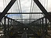 Walkway on top of the bridge showing the pulley cable