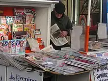 Image 19Newspaper vendor, Paddington, London, February 2005 (from Newspaper)